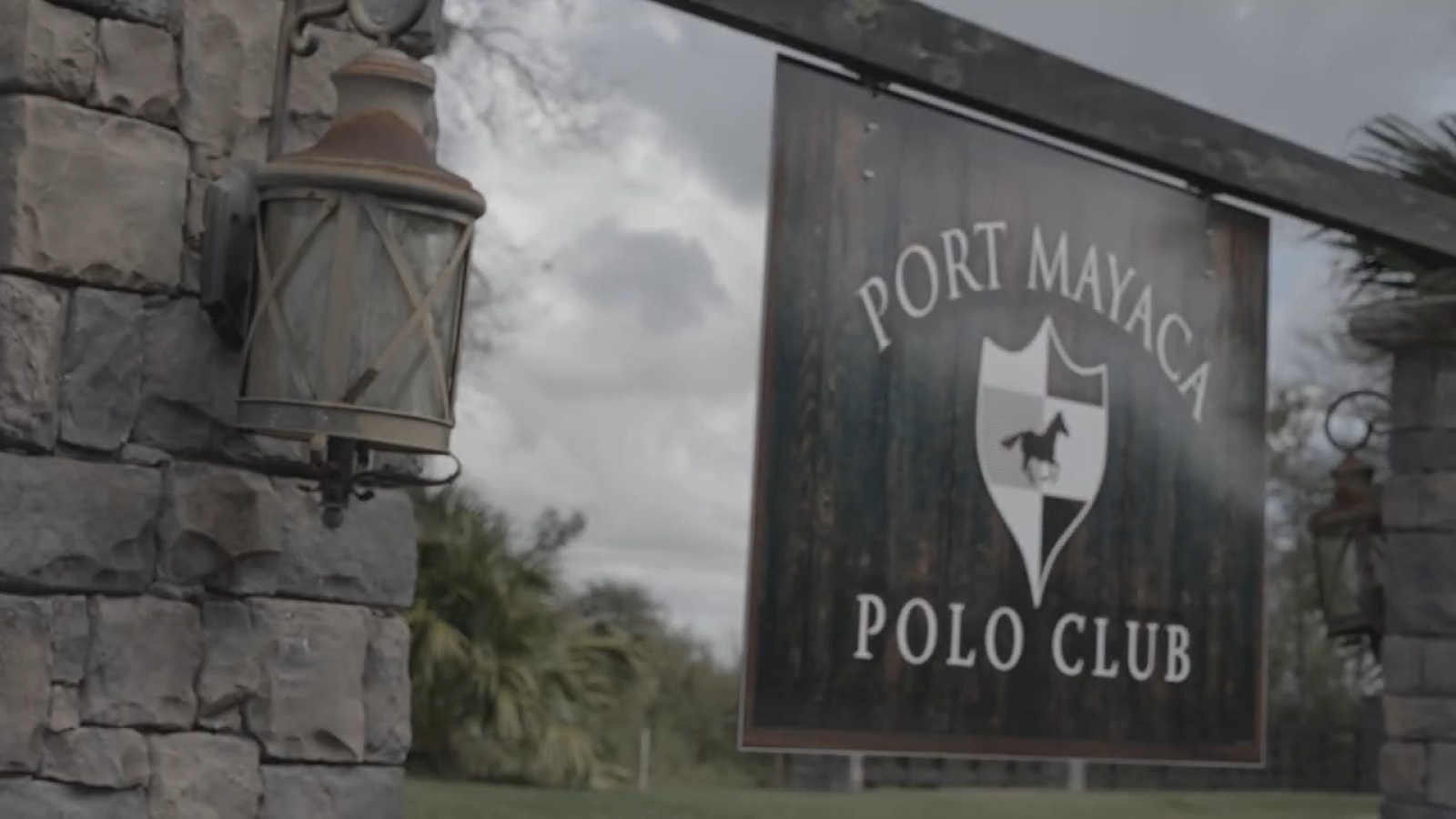 signboard Port Mayaca polo club and street light on the left side