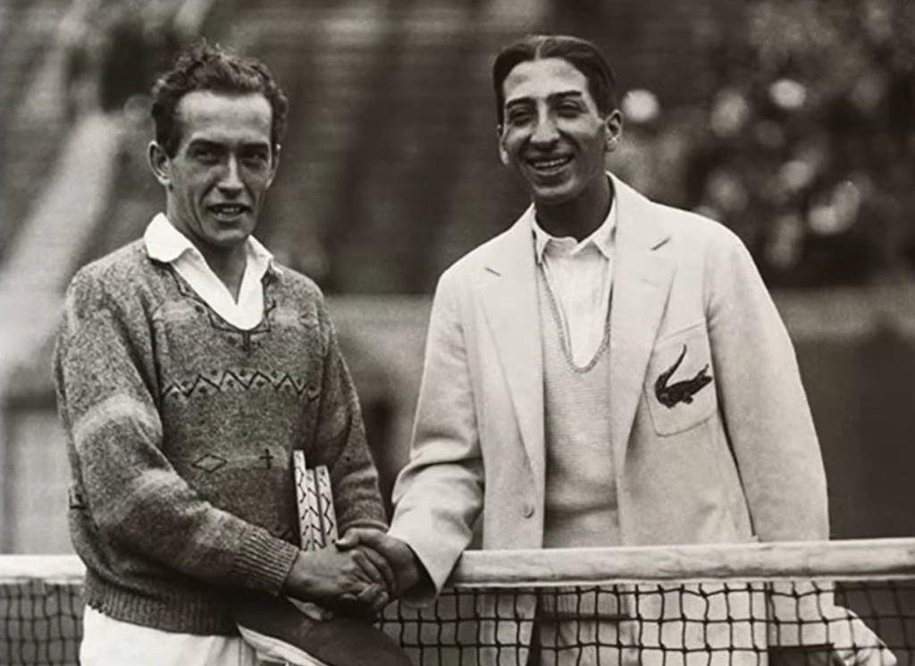Rene Lacoste and tennis player shaking hands - black and white photo
